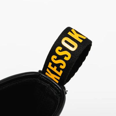 Bocchi The Rock! SuperGroupies Kessoku Band boots: Yellow heel tab with KESSOKU lettering.
