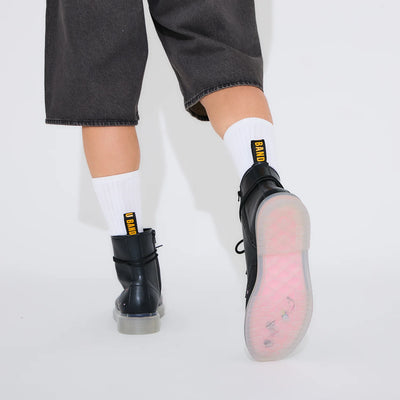Bocchi The Rock! SuperGroupies Kessoku Band boots: Worn boot raised to reveal the pink Tsuchinoko Bocchi sole.