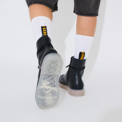 Bocchi The Rock! SuperGroupies Kessoku Band boots: Worn boot raised to reveal the Kessoku Band logo sole.